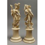 A VERY GOOD PAIR OF EUROPEAN CARVED IVORY FIGURES, GALLANT AND LADY on ivory plinth. 10ins high.