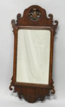 A GEORGE III DESIGN MAHOGANY AND INLAID FRET WORK FRAMED MIRROR with pierced and carved cresting.