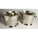 A PAIR OF OVAL SILVER-PLATED WINE COOLERS with ring handles. 13ins long.