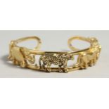 A SUPERB 18CT GOLD ANIMAL BANGLE pierced with rhino, elephant, leopard, tiger, and ox. 6cm diameter,
