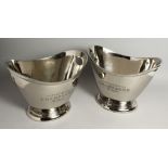 A PAIR OF OVAL SILVER-PLATED WINE COOLERS. 12ins long.