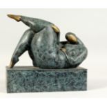 A SMALL MODERN PATINATED BRONZE of an overweight lady in seductive pose on a rectangular base. 10ins