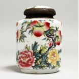 A CHINESE PORCELAIN CIRCULAR PEACH TEA JAR AND COVER.