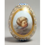 A GOOD PORCELAIN EGG, POSSIBLY RUSSIAN, painted with a cupid's head. 9cm long.