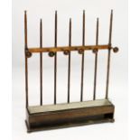 AN UNUSUAL ARTS AND CRAFTS OAK LOW HALL STAND / STICK STAND, possibly Liberty & Co., with turned