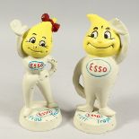 A PAIR OF PAINTED CAST IRON ESSO FIGURES. 9ins high.