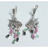 A PAIR OF SILVER MARCASITE, RUBY, AND EMERALD ANGEL FISH EARRINGS.