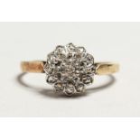 A 9CT GOLD DIAMOND CLUSTER RING.