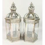 A PAIR OF HEXAGONAL SILVERED METAL LANTERNS 24ins high.