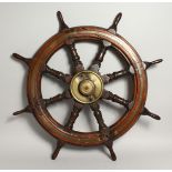 A VERY GOOD SHIP'S WHEEL with brass centre. 33ins diameter.