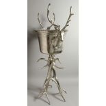 A LARGE SILVER-PLATED STAG WINE COOLER on a plated antler stand. 41ins high.