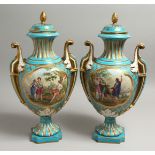 A VERY GOOD PAIR OF 19TH CENTURY SEVRES PALE BLUE TWO HANDLED URNS AND COVERS painted with reverse