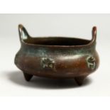 A SMALL CHINESE BRONZE CIRCULAR CENSER, the side with calligraphy. 8cm diameter.