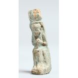 A SMALL EGYPTIAN USHABTI FAIENCE FIGURE 1.5ins high on a stand.