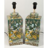 A GOOD PAIR OF PORCELAIN SQUARE LAMPS decorated with parrots and flowers. 22ins high
