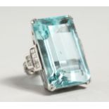 A SUPERB LARGE ART DECO AQUAMARINE 45ct AND DIAMOND SET RING, in 18ct white gold. By Edw. Reeves,