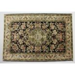 A PERSIAN DESIGN PART SILK RUG, black ground with all over floral decoration. 5ft x 3ft 6ins.