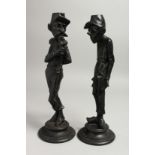 A PAIR OF 19TH CENTURY SPELTER FIGURES on circular bases. 13ins high.