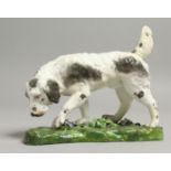 A 19TH CENTURY DERBY FIGURE OF A HOUND