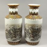 A LARGE PAIR OF CHINESE PORCELAIN VASES with mountain scenes. 25ins high.