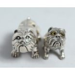 A SILVER PAIR OF CAST SILVER FIGURES OF DOGS.