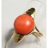 A GOLD CORAL SET RING