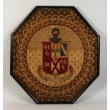 A GOOD 19TH CENTURY EMBROIDERED ARMORIAL, octagonal, framed. 31ins x 31ins.