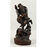 A CHINESE CARVED WOOD FISHERMAN holding a carp. 18ins high.
