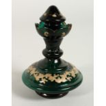 A BOHEMIAN GREEN GLASS SCENT BOTTLE AND STOPPER. 4.5ins high.