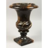 AFTER THE ANTIQUE A VEINED MARBLE URN 12ins high.