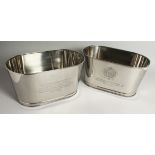 A SMALL PAIR OF LILY BOLLINGER OVAL SILVER-PLATED WINE COOLERS. 25ins long.