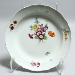 A LARGE 19TH CENTURY MEISSEN PORCELAIN CIRCULAR DISH painted with flowers. Cross swords mark in