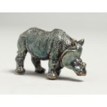 A MINIATURE SILVER RHINO 4.5cm long.