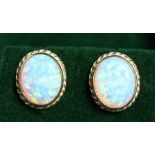 A PAIR OF 9CT GOLD, OPAL STUD EARRINGS.