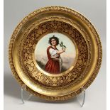 A GOOD 19TH CENTURY VIENNA PORCELAIN CIRCULAR PLATE OF DISTEL, holding a piece of holly. Beehive