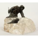 A VERY GOOD RUSSIAN ROCK CRYSTAL AND BRONZE GROUP depicting a man with a seal. 6.5ins long 5ins