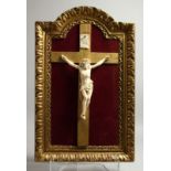 A VERY FINE ITALIAN CARVED IVORY CORPUS CHRISTI. 8ins long in a gilt frame.