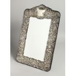 A GOOD REPOUSSE UPRIGHT MIRROR. 16.5ins x 10ins.