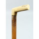 A WALKING STICK with bone handle. 33ins long.