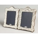 A LARGE PAIR OF SILVER PHOTOGRAPH FRAMES. 19cm x 14cm.