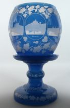 A SUPERB LARGE BOHEMIAN BLUE BOWL ON STAND, engraved with fruiting vines and eight engravings of