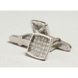 A PAIR OF 18CT WHITE GOLD DIAMOND CUFF LINKS.