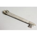 A LARGE ENGINE TURNED SILVER CIGAR CUTTER, .925, MAKER J C V., 8ins long.