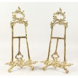 A PAIR OF BRASS PICTURE EASELS. 20ins high.
