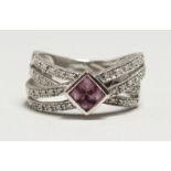 A 9CT WHITE GOLD PINK SAPPHIRE AND DIAMOND RING.