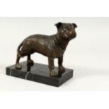 A SMALL BRONZE DOG on a marble base. 6ins long,