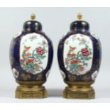 A PAIR OF SAMSON OF PARIS CHINESE DESIGN PORCELAIN JARS AND COVERS, with decorative ormolu finials
