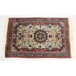 A PERSIAN RUG, cream ground with all over floral decoration. 5ft 6ins x 3ft 7ins