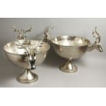A SIMILAR PAIR OF SILVER-PLATED STAG WINE COOLERS on circular bases.