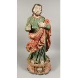 AN 18TH CENTURY CARVED WOOD POLYCHROME FIGURE OF SAINT JOSEPH. 29ins high.